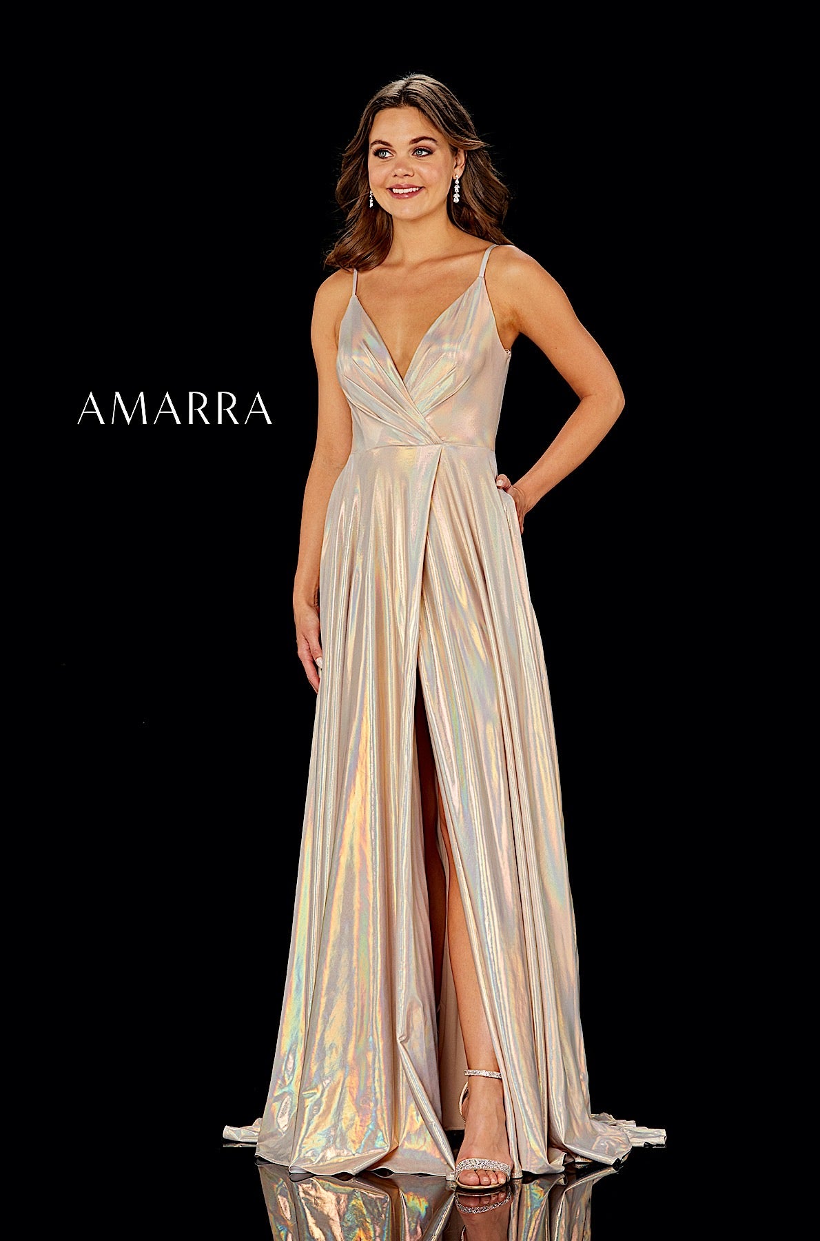 Model wearing a glamorous evening gown with a high slit by Amarra on a black background