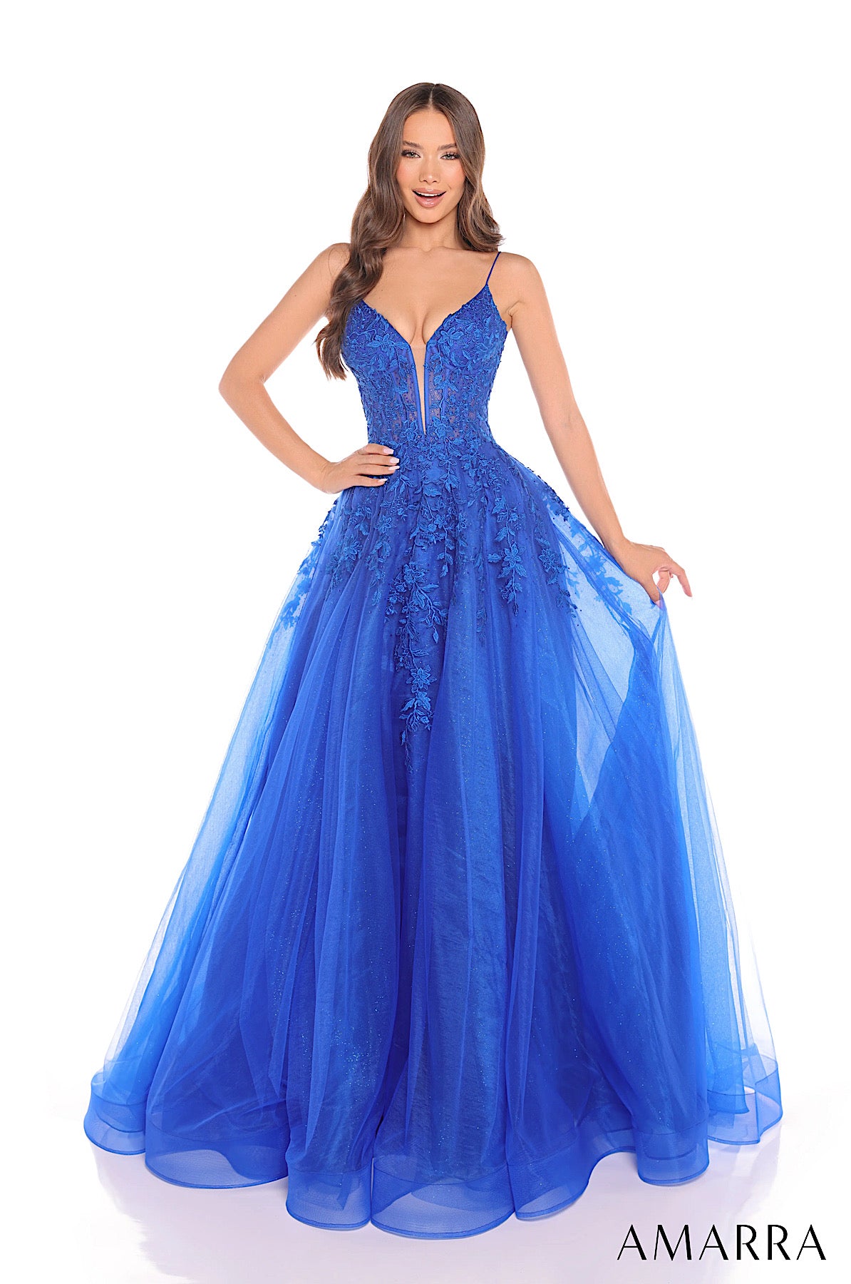 Blue evening gown with intricate detailing on a white background, featuring the brand 'AMARRA'.
