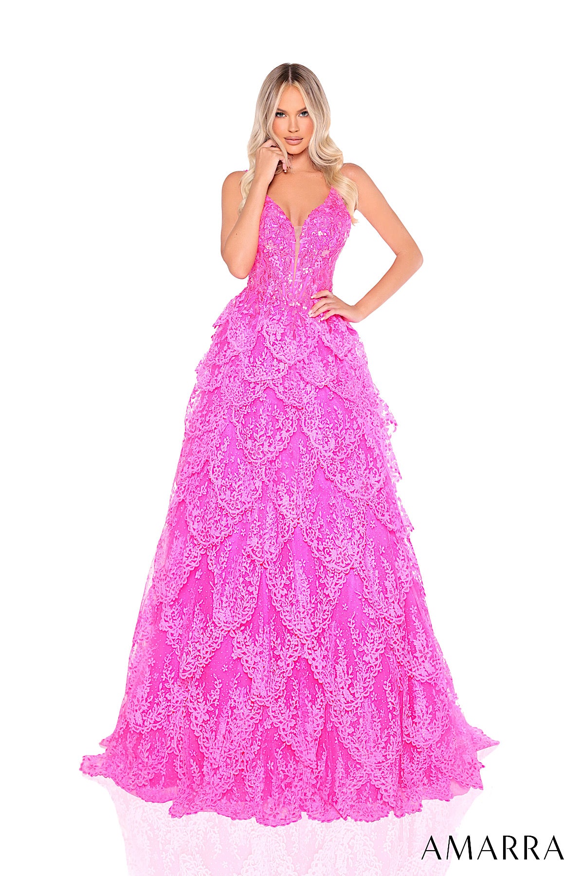 Pink lace evening gown on a white background with 'AMARRA' branding. ONLY AT THE BRIDAL COMPANY