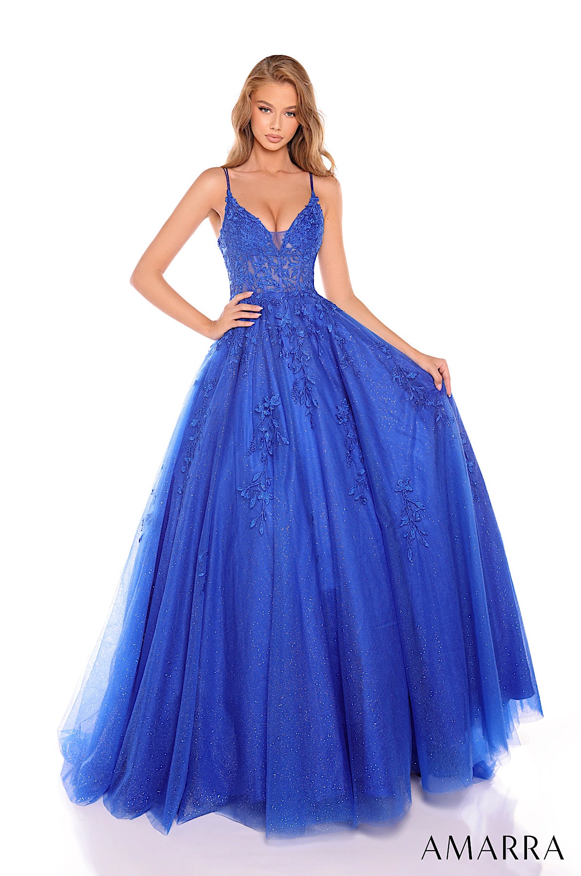 Blue evening gown with intricate detailing on a white background, featuring the brand 'AMARRA'.