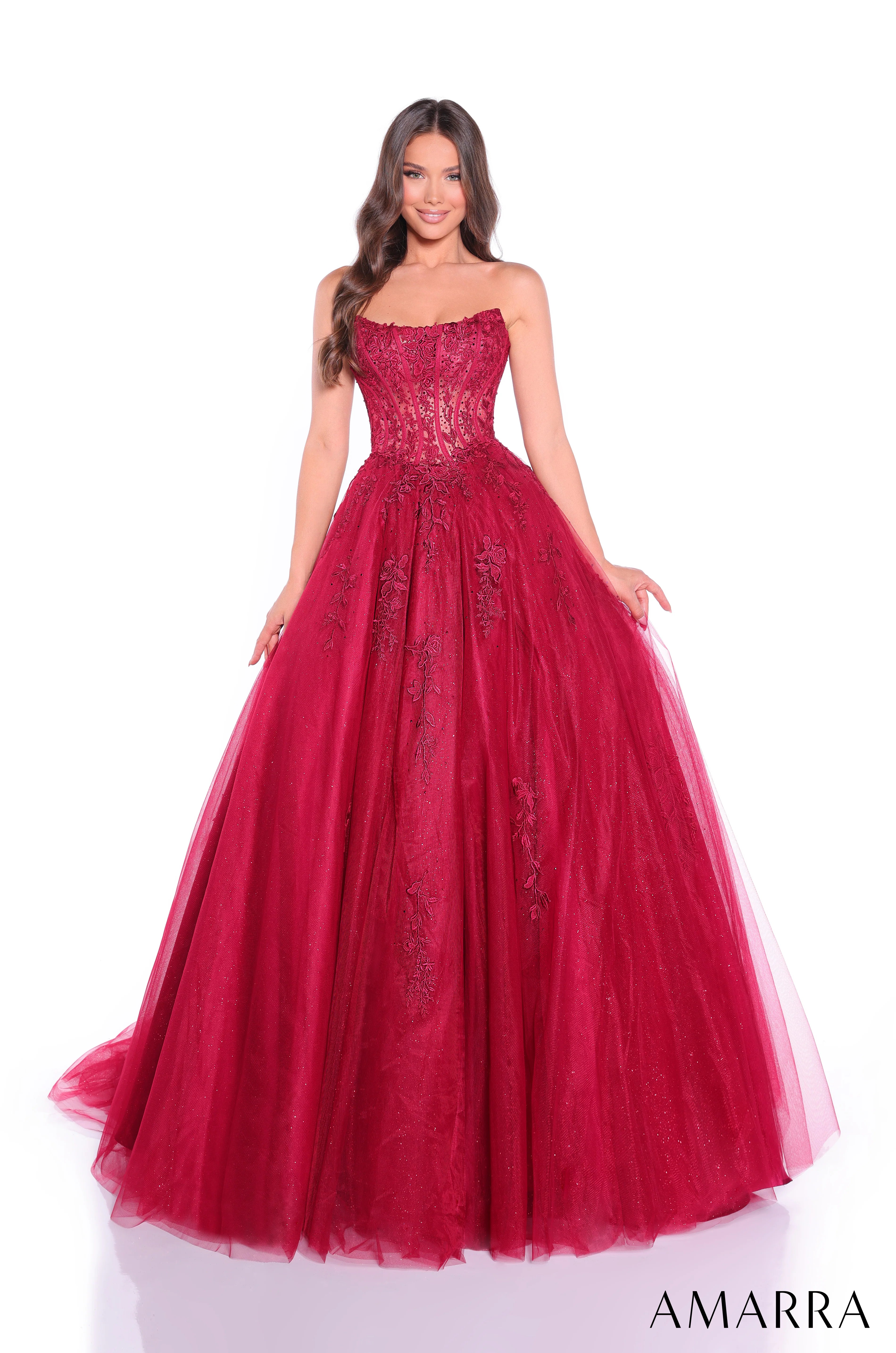 Red evening gown with lace detailing on a white background, featuring the brand 'AMARRA'.
