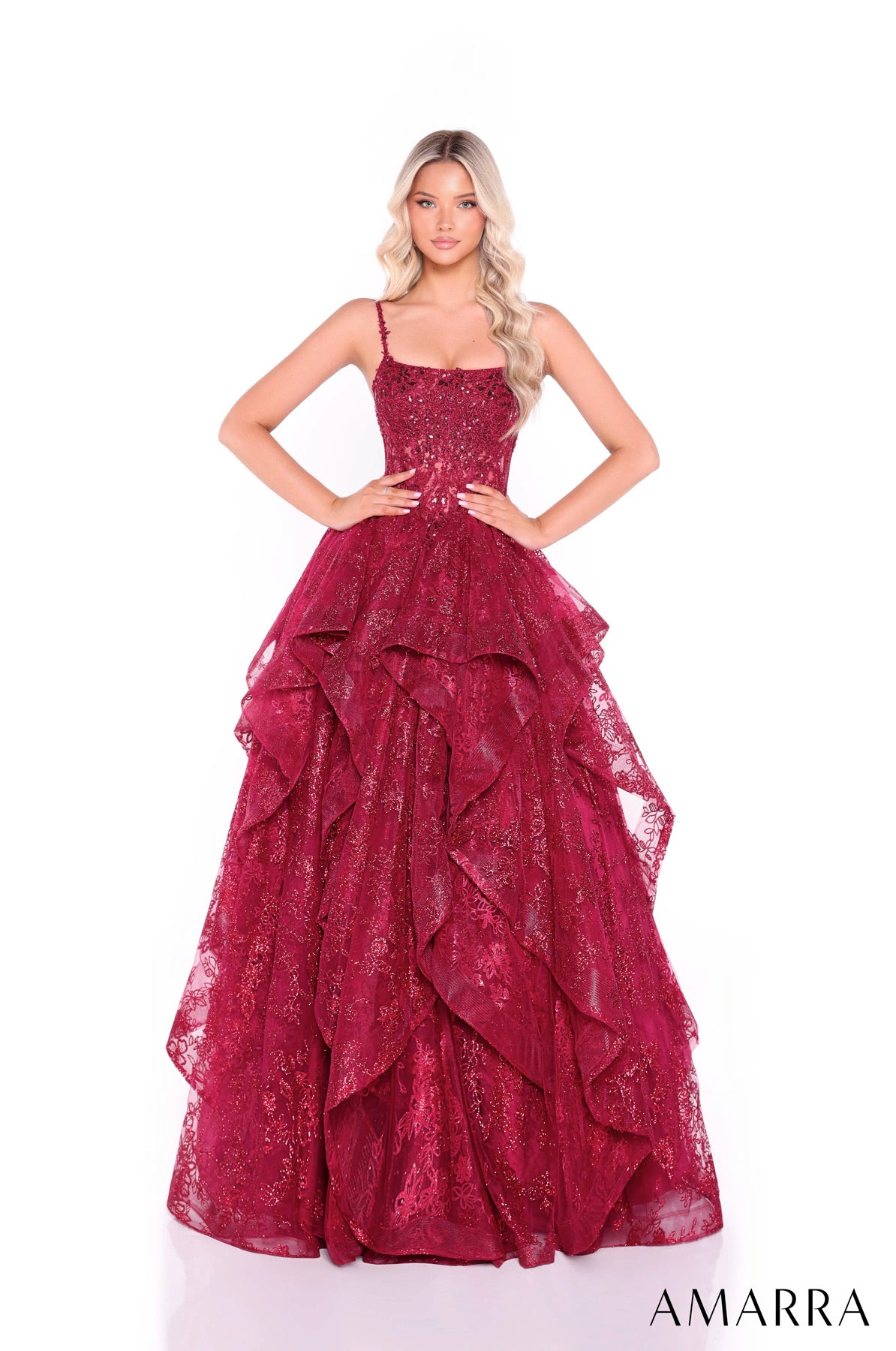 Red evening gown with ruffled layers on a white background, featuring the brand 'AMARRA'. at the bridal company gold coast brisbane australia