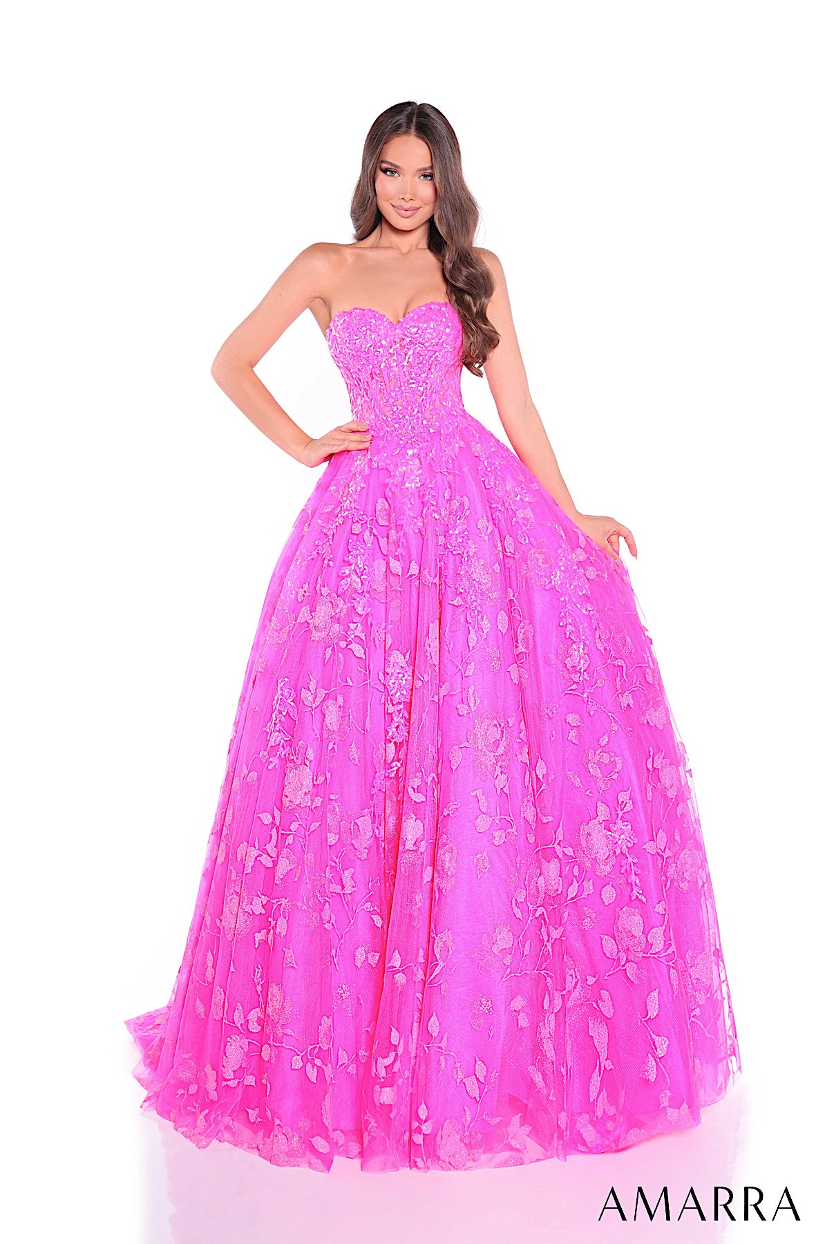 Pink strapless gown with floral details on a white background, brand 'AMARRA' visible.