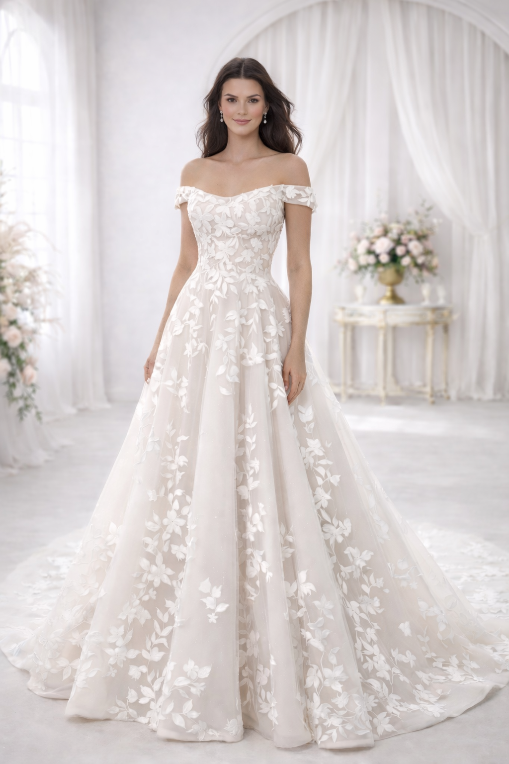 Woman wearing a white floral off-shoulder gown in a softly lit room.