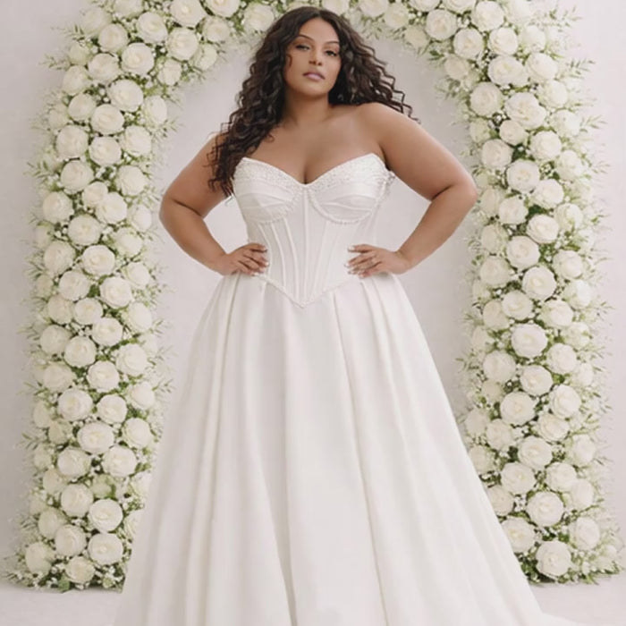 plus size woman in ivory wedding gown