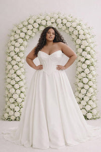 plus size woman in ivory wedding gown