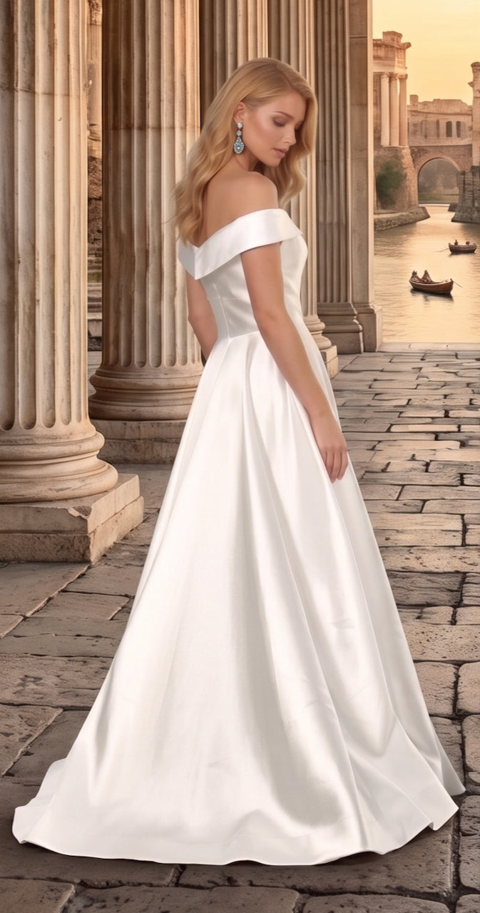 Woman in a white off-shoulder gown standing in an ancient ruin setting. the bridal company